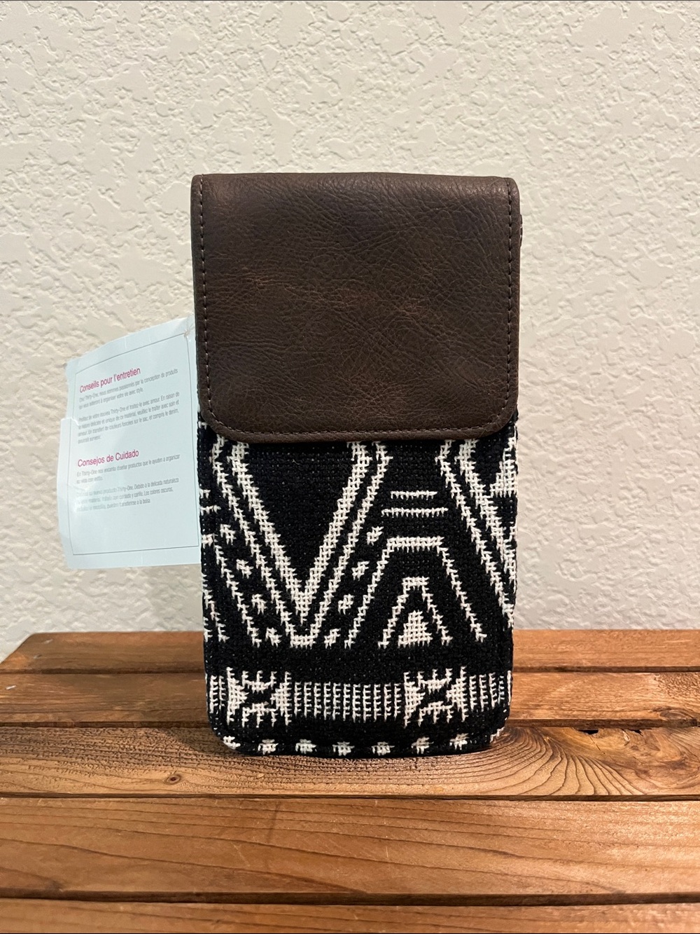Thirty-one Call Me Crossbody. Black and White Aztec Phone Wallet with Brown Trim
